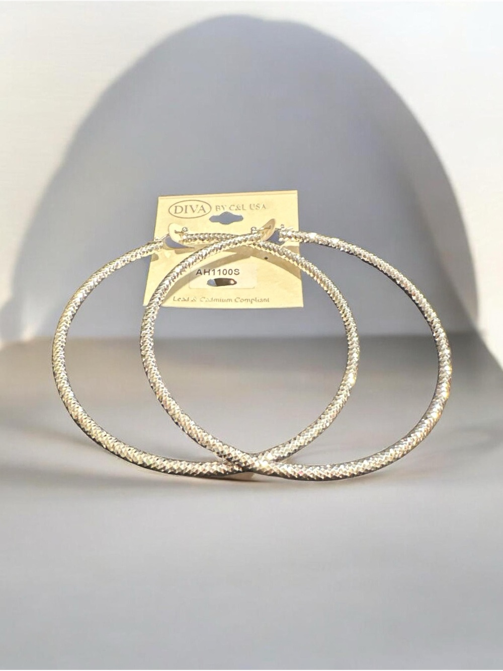 Diva Silver-Tone Textured Large Hoop Earrings
374